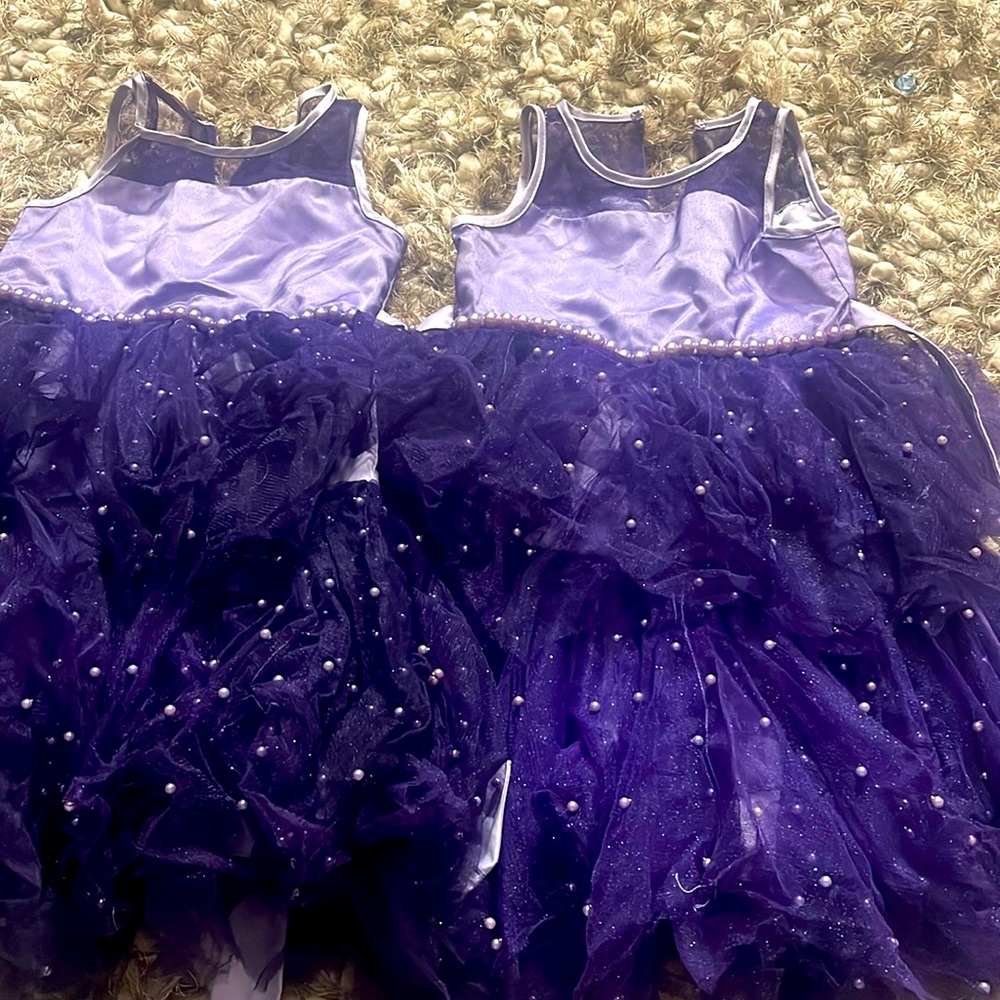 Two pair of girls size 7 purple dresses